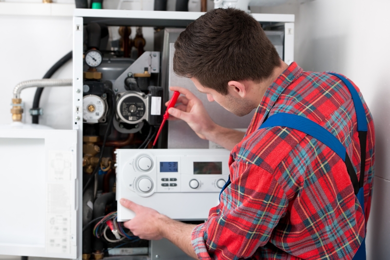 Gas Safe engineer working on a boiler in Dalston